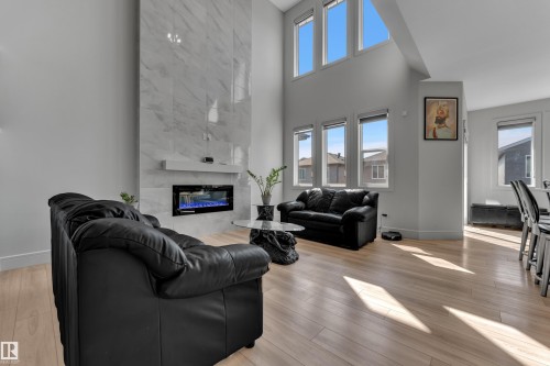3811 42 Avenue, Beaumont, AB - Indoor Photo Showing Living Room With Fireplace