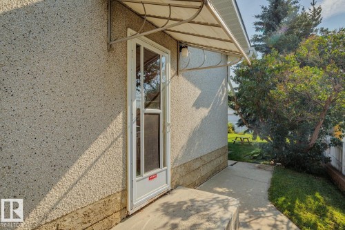 Entryway featuring a glass-paneled door with an overhead awning - 12835 91 Street Nw, Edmonton, AB - Outdoor