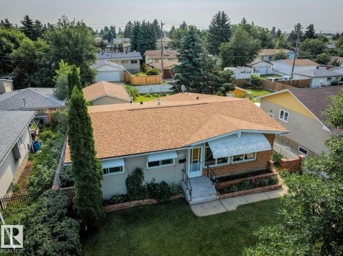 Single-story residence featuring a brown shingle roof and brick facade accents - 12835 91 Street Nw, Edmonton, AB - Outdoor
