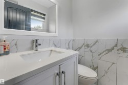 Bathroom vanity with an integrated sink and chrome faucet - 