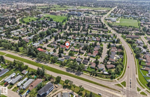 Aerial perspective showcasing a residential neighborhood with surrounding infrastructure - 7419 33 Avenue Nw, Edmonton, AB - Outdoor With View