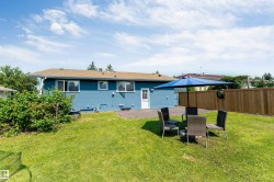 Expansive lawn area with a privacy fence - 