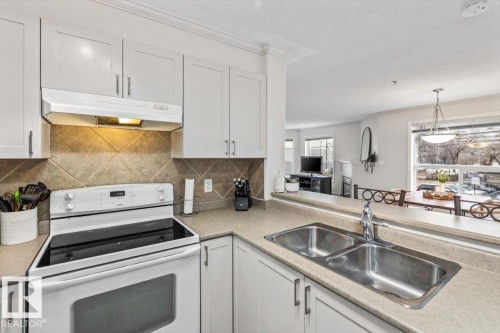 #206 9938 104 St Nw, Edmonton, AB - Indoor Photo Showing Kitchen With Double Sink