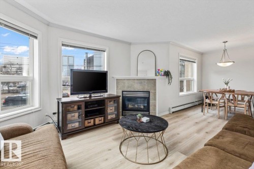 #206 9938 104 St Nw, Edmonton, AB - Indoor Photo Showing Living Room With Fireplace
