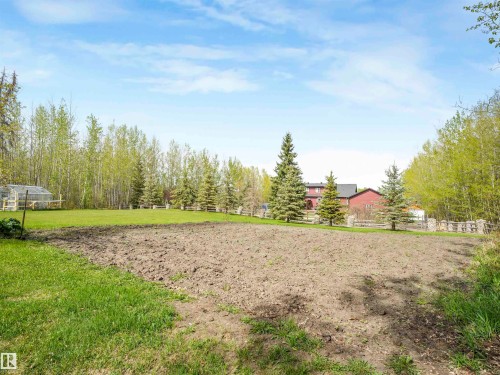 Expansive cleared land featuring cultivated soil and surrounding green lawn - 16 Crystal Keys Crescent, Rural Wetaskiwin County, AB - Outdoor With View
