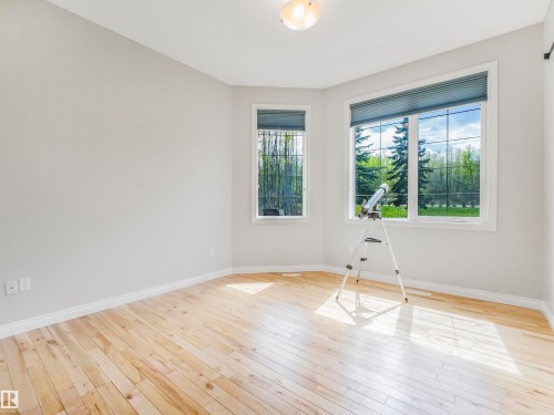 Neutral-toned walls complement natural wood flooring - 16 Crystal Keys Crescent, Rural Wetaskiwin County, AB - Indoor Photo Showing Other Room