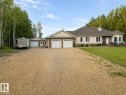 Exterior featuring a large gravel driveway, a two-car attached garage, and a separate single-car detached garage - 16 Crystal Keys Crescent, Rural Wetaskiwin County, AB  - Outdoor With Facade 