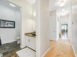 Powder room featuring a vessel sink, single vanity, and slate tile flooring - 
