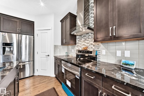 6122 175A Avenue Nw, Edmonton, AB - Indoor Photo Showing Kitchen With Stainless Steel Kitchen With Upgraded Kitchen