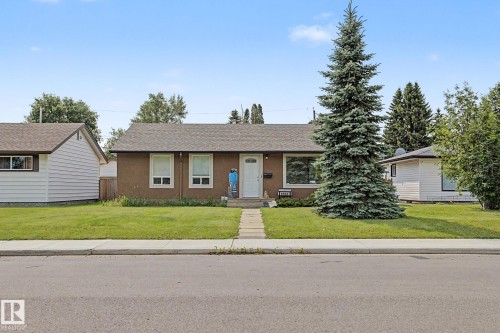 Single-story home featuring a stucco exterior and a pitched shingle roof - 8823 130A Avenue Nw, Edmonton, AB - Outdoor