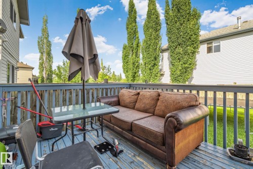 Outdoor deck featuring wood-finish flooring and a wood-slat railing - 2819 33 Street Nw, Edmonton, AB - Outdoor With Deck Patio Veranda With Exterior