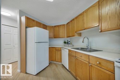 #404 17511 98A Av Nw, Edmonton, AB - Indoor Photo Showing Kitchen With Double Sink