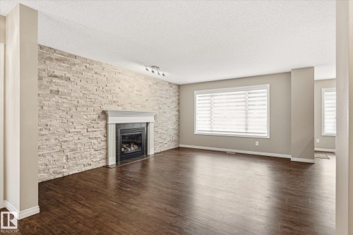 757 173B Street Sw, Edmonton, AB - Indoor Photo Showing Living Room With Fireplace