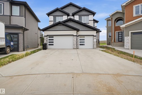 Contemporary two-story home featuring a dual-tone facade with stone accents - 304 33 Avenue Nw, Edmonton, AB - Outdoor
