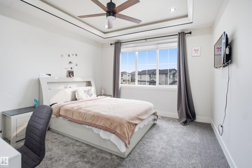 Bedroom featuring a tray ceiling with recessed lighting and a ceiling fan - 304 33 Avenue Nw, Edmonton, AB - Indoor Photo Showing Bedroom