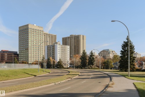 Urban landscape featuring multiple high-rise buildings, paved roads, and manicured green spaces - 11305 79 Avenue Nw, Edmonton, AB - Outdoor