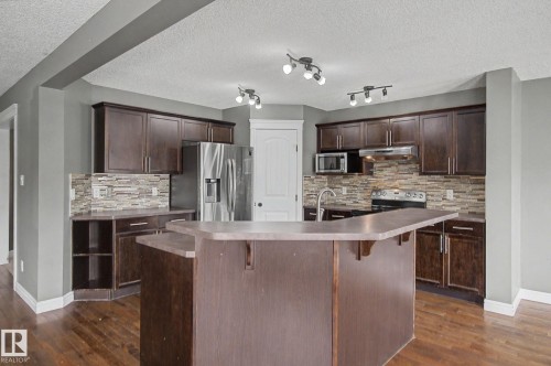 5 Cypress Link, Fort Saskatchewan, AB - Indoor Photo Showing Kitchen With Stainless Steel Kitchen With Double Sink With Upgraded Kitchen