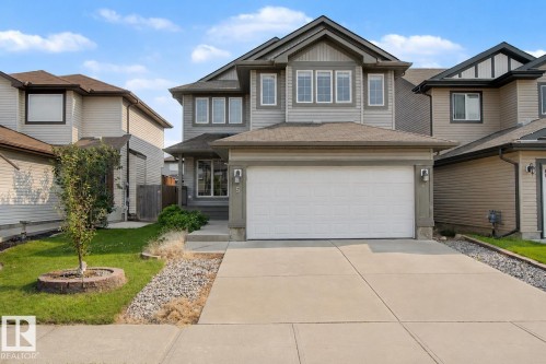 Contemporary two-story residence featuring grey siding and dark trim accents - 5 Cypress Link, Fort Saskatchewan, AB - Outdoor With Facade