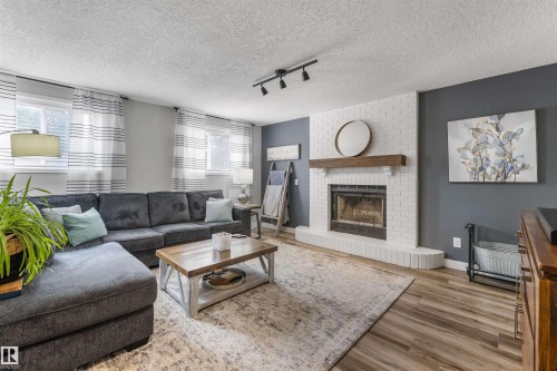 3 Denault Place, St. Albert, AB - Indoor Photo Showing Living Room With Fireplace