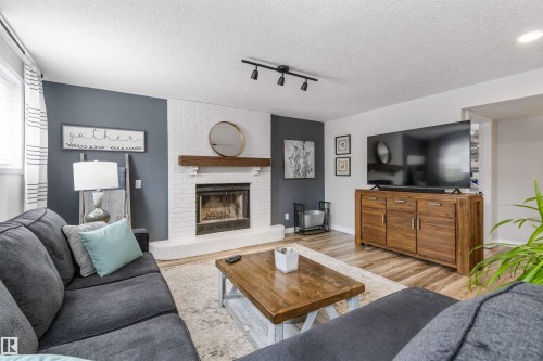 3 Denault Place, St. Albert, AB - Indoor Photo Showing Living Room With Fireplace