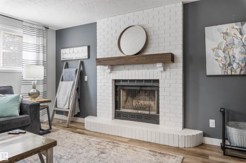 3 Denault Place, St. Albert, AB - Indoor Photo Showing Living Room With Fireplace