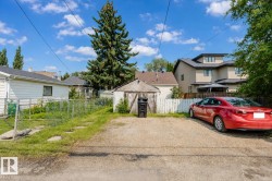 Gravel parking area featuring an existing storage shed - 