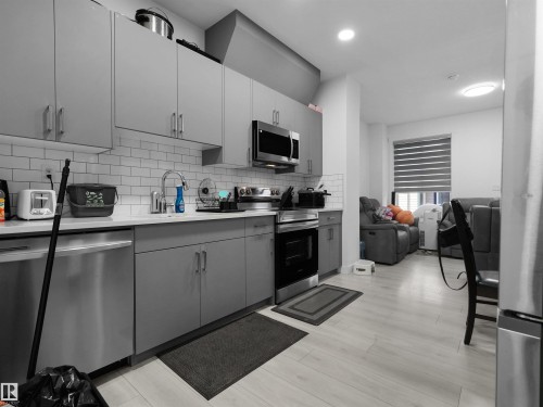 #7 7110 Keswick Common Sw, Edmonton, AB - Indoor Photo Showing Kitchen With Stainless Steel Kitchen With Upgraded Kitchen