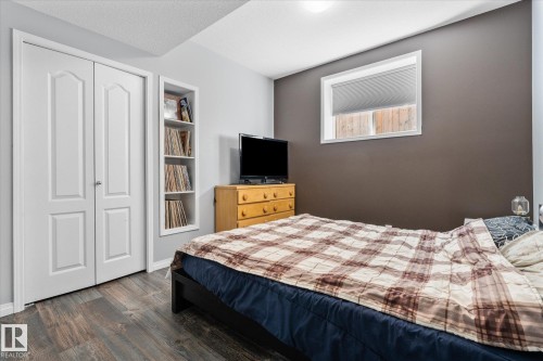 Wood-finish flooring throughout - 4009 158 Avenue Nw, Edmonton, AB - Indoor Photo Showing Bedroom