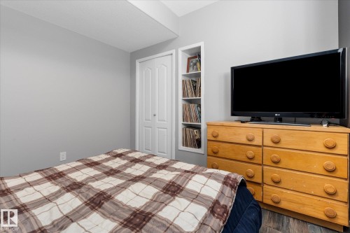 Bedroom featuring light gray walls and wood-finish flooring - 4009 158 Avenue Nw, Edmonton, AB - Indoor Photo Showing Bedroom