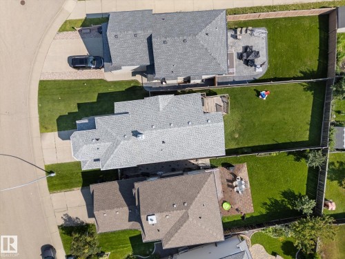 Aerial perspective showcasing a fully fenced backyard with a green lawn - 4009 158 Avenue Nw, Edmonton, AB - Outdoor With View