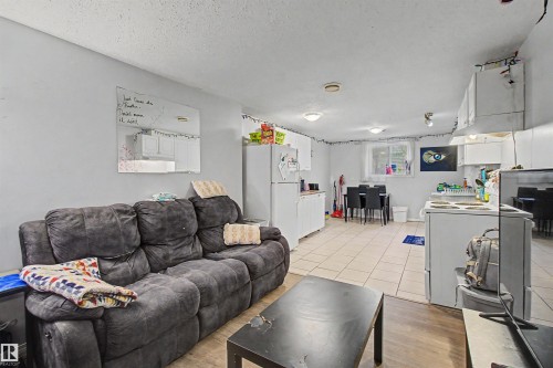 Spacious open-concept living area featuring light gray walls and recessed lighting - 8215 149 Street Nw, Edmonton, AB - Indoor Photo Showing Living Room