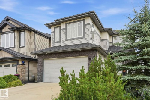 Contemporary two-story exterior featuring a stone and siding facade - 1051 174 Street Sw, Edmonton, AB - Outdoor