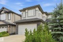 Contemporary two-story exterior featuring a stone and siding facade - 1051 174 Street Sw, Edmonton, AB  - Outdoor 