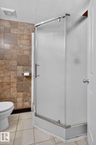 Frosted glass shower enclosure with chrome hardware - 8923 173 Avenue Nw, Edmonton, AB - Indoor Photo Showing Bathroom