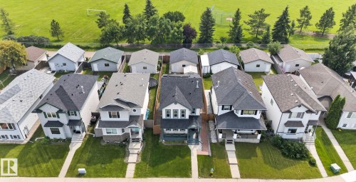 Aerial perspective showcasing a row of residential properties with varied architectural styles - 8923 173 Avenue Nw, Edmonton, AB - Outdoor With View