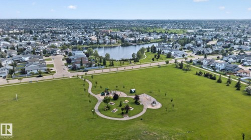 Expansive green space featuring a playground, walking path, and surrounding residential area - 8923 173 Avenue Nw, Edmonton, AB - Outdoor With View