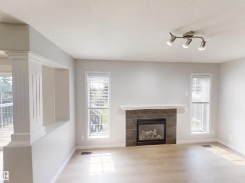 21107 58 Avenue Nw, Edmonton, AB - Indoor Photo Showing Living Room With Fireplace