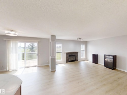 21107 58 Avenue Nw, Edmonton, AB - Indoor Photo Showing Living Room With Fireplace