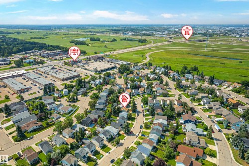 Aerial perspective showcasing a residential neighborhood with curved streets, mature trees, and individual homes - 281 Vantage Lane, Sherwood Park, AB - Outdoor With View