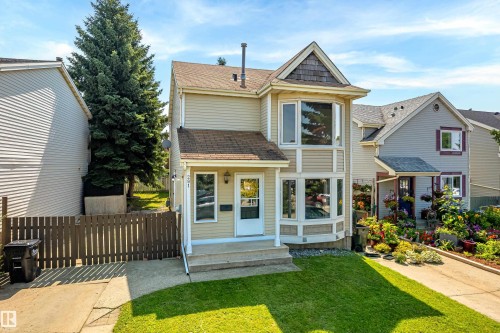 Two-story residence featuring light-colored siding and a contrasting brown roof - 281 Vantage Lane, Sherwood Park, AB - Outdoor