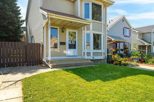 Two-story residence featuring light-colored siding and a covered front porch - 281 Vantage Lane, Sherwood Park, AB - Outdoor With Deck Patio Veranda