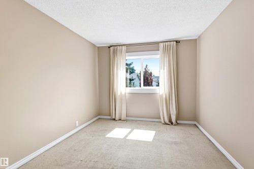 Neutral tone walls and beige carpet create a versatile backdrop - 281 Vantage Lane, Sherwood Park, AB - Indoor Photo Showing Other Room