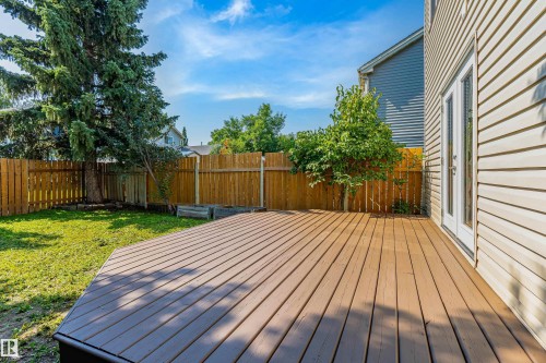Spacious outdoor deck with wood-finish planks and direct access to the interior - 281 Vantage Lane, Sherwood Park, AB - Outdoor