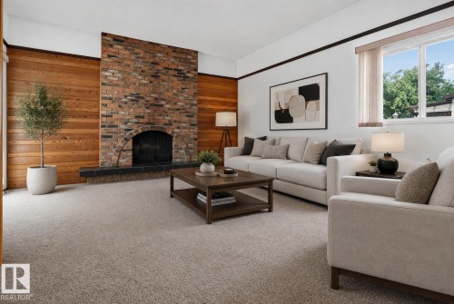 Brick fireplace with an arched firebox and slate hearth, complemented by wood paneling - 6012 145 Avenue Nw, Edmonton, AB - Indoor Photo Showing Living Room With Fireplace