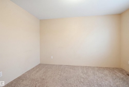 Neutral-toned wall finishes - #22 723 172 Street Sw, Edmonton, AB - Indoor Photo Showing Other Room