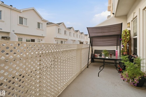 Private outdoor patio area with a lattice privacy screen - #22 723 172 Street Sw, Edmonton, AB - Outdoor With Exterior