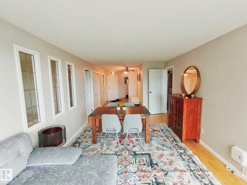 Bright interior space featuring light-toned walls and wood-finish flooring - #509 10149 Saskatchewan Dr Nw, Edmonton, AB - Indoor
