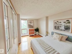 Spacious room featuring light wood-finish flooring - 