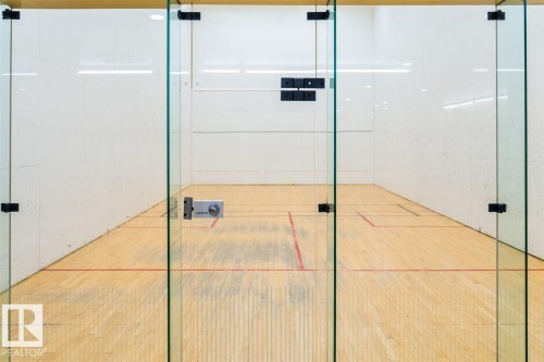 Indoor court with wood-finish flooring and white textured walls - #509 10149 Saskatchewan Dr Nw, Edmonton, AB - Indoor Photo Showing Bathroom