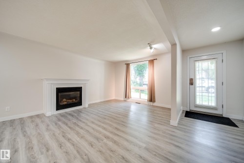 10519 140 Street Nw, Edmonton, AB - Indoor Photo Showing Living Room With Fireplace